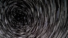 Time lapse of Star trails in the night sky. Stars move around a polar star. Vertical video - Powered by Shutterstock - Get 15% off with code: PIKWIZARD15