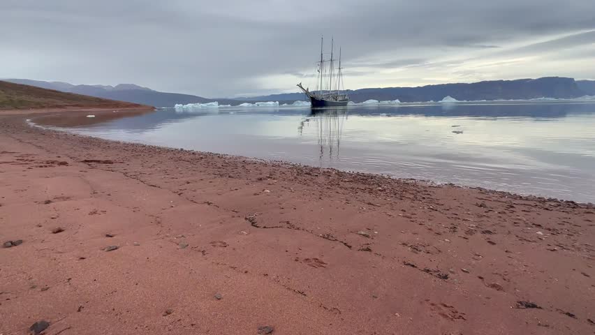 Schooner is anchored in Rødefjord. Scoresbysund, Greenland.