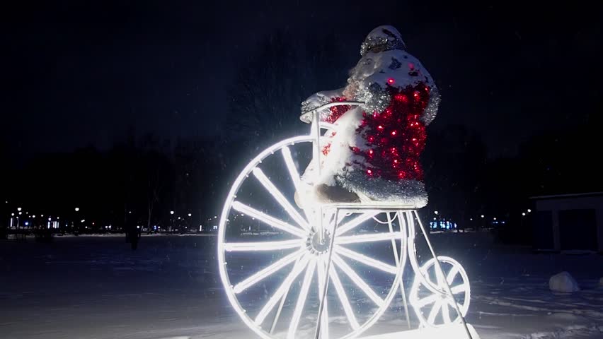 Santa Claus on a bicycle, Christmas decoration. | Shutterstock HD Video #1112043595