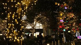 TOKYO, JAPAN - DECEMBER 2021 : Christmas illumination, Christmas tree and snow at Roppongi area. Scenery of downtown city and street at night. Japanese winter and Christmas season concept. - Powered by Shutterstock - Get 15% off with code: PIKWIZARD15