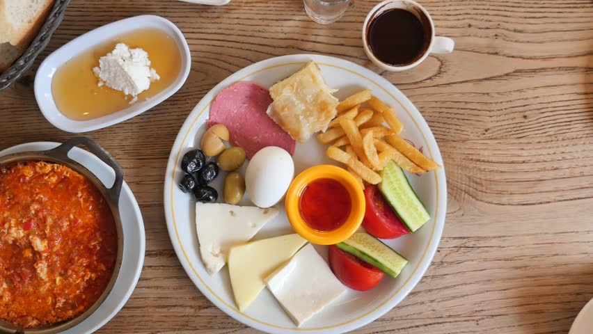 turkish breakfast of cheese, cucumber, egg, olive and tomato