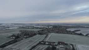 Aerial Drone Shot of a frozen landscape around a Suffolk Village, UK