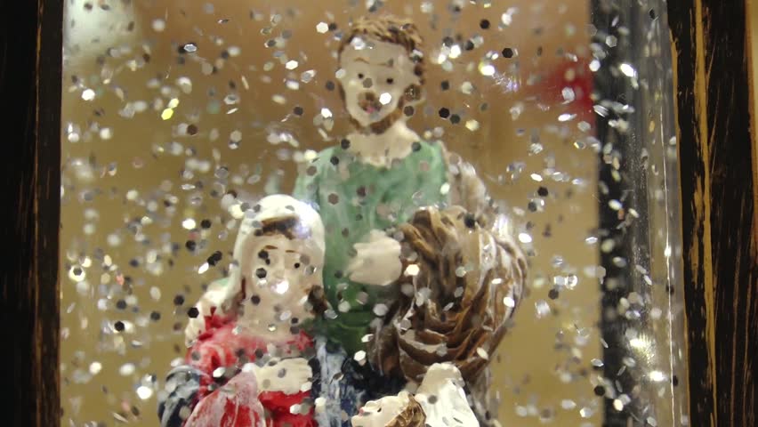 Christmas glass snow globe with Santa Claus snowman snowflakes and floating glitter. Christmas snow globe with snow falling. Nativity scene by the Christmas tree - Powered by Shutterstock - Get 15% off with code: PIKWIZARD15