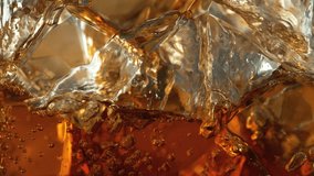 Super Slow Motion Detail Shot of Pouring Lemonade on Perfect Clear Ice Cubes at 1000fps. - Powered by Shutterstock - Get 15% off with code: PIKWIZARD15