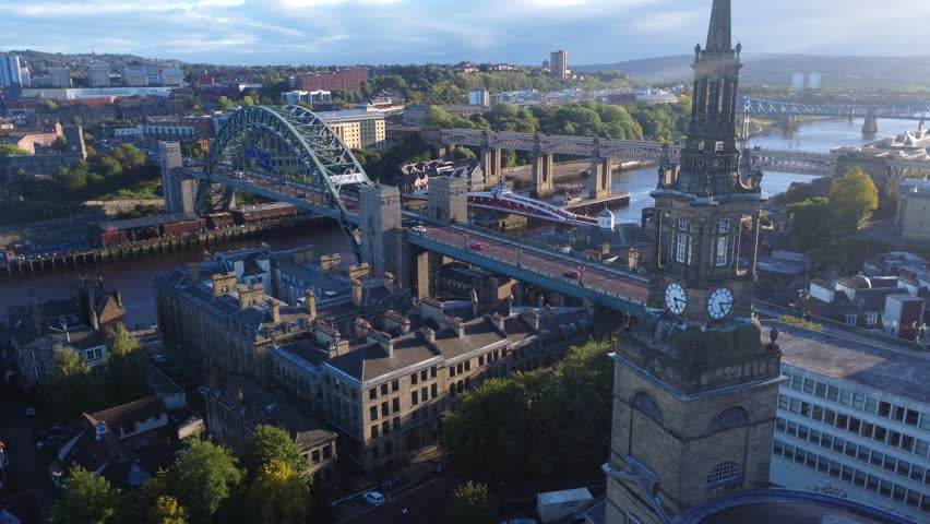 Cinematic drone video of Quayside and iconic bridges in Newcastle Upon Tyne, England Royalty-Free Stock Footage #1112057797