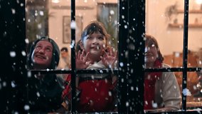 Cute little girl look through the window feel exciting to see snowfall first time of winter season. Adorable child sitting in a beautifully decorated living room in Christmas festival with family. - Powered by Shutterstock - Get 15% off with code: PIKWIZARD15