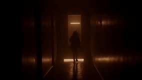 Silhouette woman runs along a dark corridor. Orange light. - Powered by Shutterstock - Get 15% off with code: PIKWIZARD15