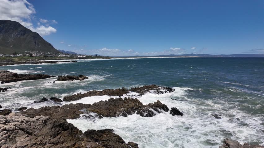 View of the beautiful Hermanus coastline across Walker Bay from the Cliff Path near Sievers Point. Overberg, western Cape, South Africa. Royalty-Free Stock Footage #1112073551
