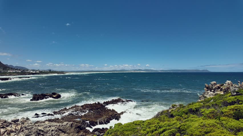 View of the beautiful Hermanus coastline across Walker Bay from the Cliff Path near Sievers Point. Overberg, western Cape, South Africa. Royalty-Free Stock Footage #1112073553