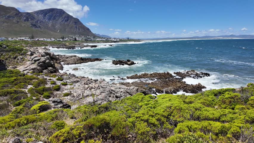 View of the beautiful Hermanus coastline across Walker Bay from the Cliff Path near Sievers Point. Overberg, western Cape, South Africa. Royalty-Free Stock Footage #1112073555