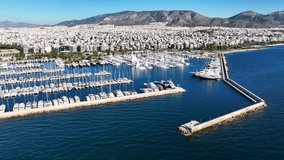 Aerial drone video from beautiful Marina of Alimos with many luxury yachts and sail boats anchored, Athens riviera, Attica, Greece