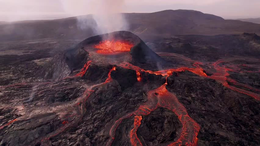Volcano Eruption Fagradalsfjall Iceland. Aerial Around Erupting Fire Volcano At Sunset. Magma Flowing Lava Shooting Out of Caldera. Dangerous Drone Flight. Royalty-Free Stock Footage #1112083273