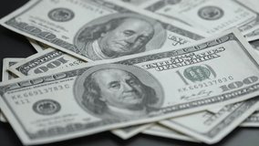 US currency : close-up of hundred dollar bills, slow motion - Powered by Shutterstock - Get 15% off with code: PIKWIZARD15