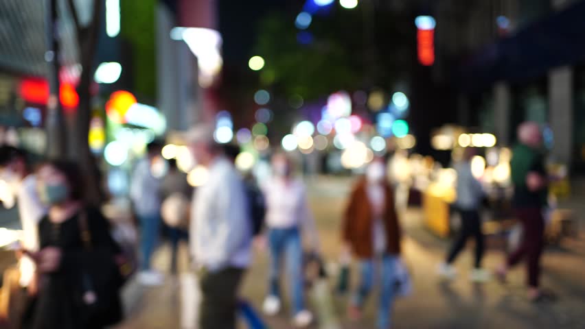 Blurred Myeongdong street market at night in Seoul, South Korea