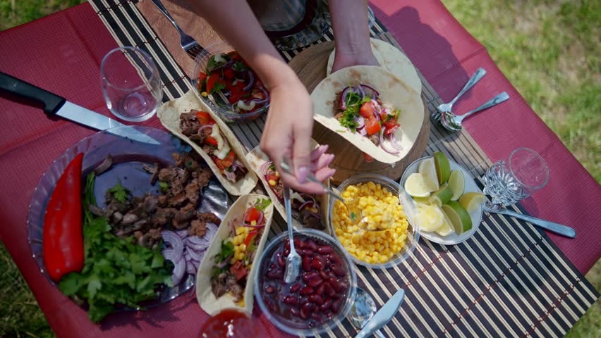 Tex mex Food. Traditional Mexican Pork Tacos. American Burrito Fajitas. Lime Juice Dripped On Delicious Mexican Tacos With Beef, Beans And Cilantro Salsa Corn Tortilla. Freshly Cooked Mexican Tacos