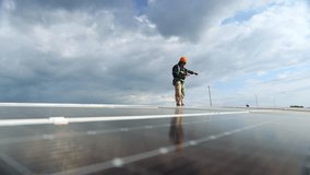 Engineer asian male electrician inspects the installation solar panels metal roof in an industrial factory walk around inspect important points each solar cell panel and record data on a clipboard.
 - Powered by Shutterstock - Get 15% off with code: PIKWIZARD15