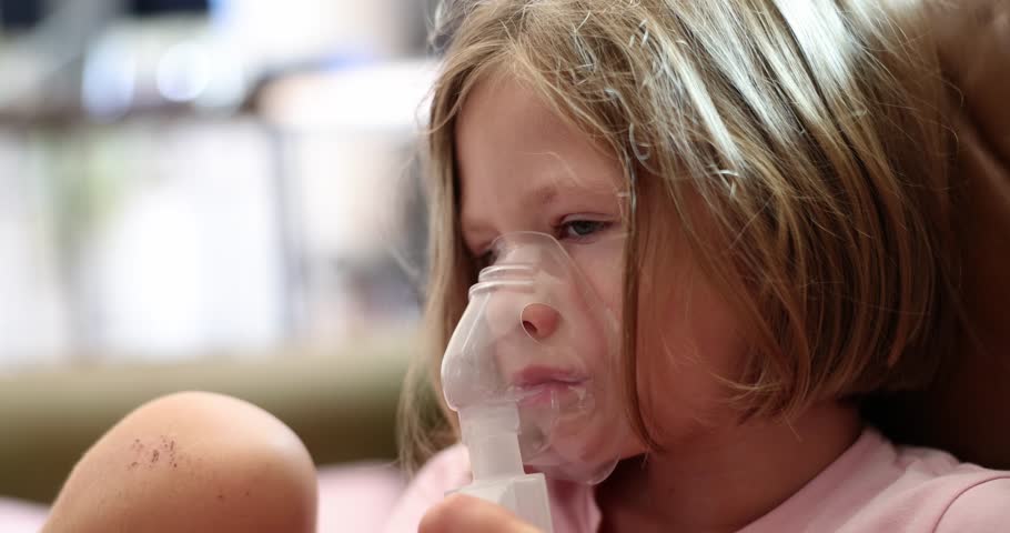 Little sick girl making inhalation with hormonal drug for laryngitis 4k movie slow motion. Pneumonia treatment concept | Shutterstock HD Video #1112085211