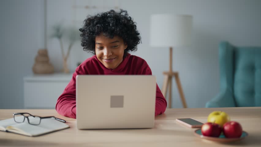 Young woman, student studying at online lesson using laptop making notes in copybook. Girl at online video conferences communicates and answers questions sitting home desk. Concept distance learning. | Shutterstock HD Video #1112086899