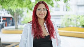 Cheerful young redhead woman exuding confidence, smiling warmly while standing in the park with a relaxed, crossed arms gesture - Powered by Shutterstock - Get 15% off with code: PIKWIZARD15