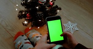 Christmas tree green screen browsing chroma key woman hand christmas socks smartphone close up