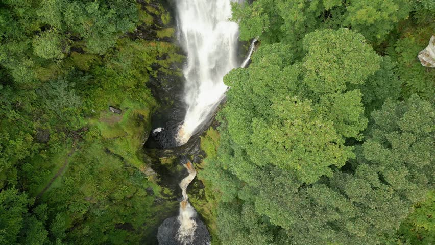 Aerial gimbal reveal clip of Llanrhaeadr-ym-Mochnant, Pistyll Rhaeadr natural Waterfall in North Wales, Oswestry, Powys, Wales