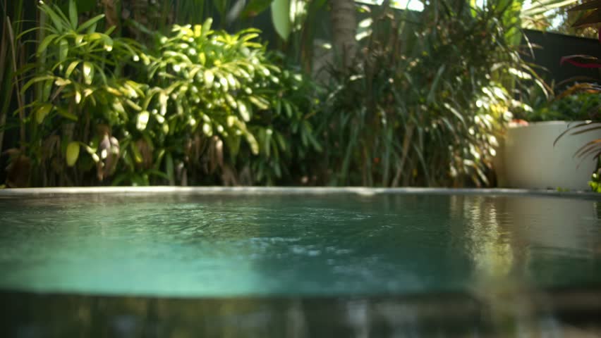 Blue water waves surface close up in swimming pool, background with copy space. 