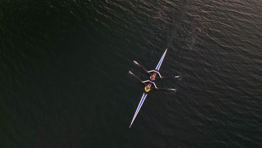 Aerial View of a Sports Canoe with a Crew of Two Women Athletes Paddling on Calm Water, Viewed from Top View. Sports Boat Rowing, Morning Training Before the Competition, Halifax, Canada. Royalty-Free Stock Footage #1112104561