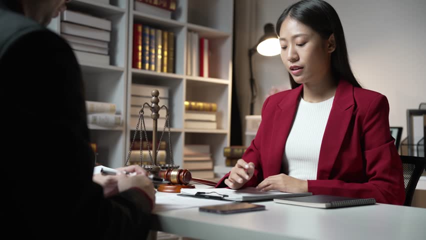 Young Asian Lawyers Meeting and Studying Law Schools in Law Firms Royalty-Free Stock Footage #1112105483