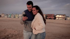 Happy couple walking on the beach at sunset. - Powered by Shutterstock - Get 15% off with code: PIKWIZARD15