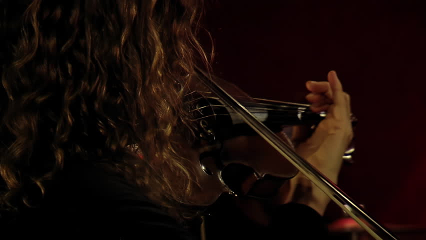 A Woman With Curly Hair Playing Violin in Recording Studio. Close Up. Royalty-Free Stock Footage #1112117431