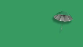 open umbrella with straight handle over green background. floating umbrella with green cloth