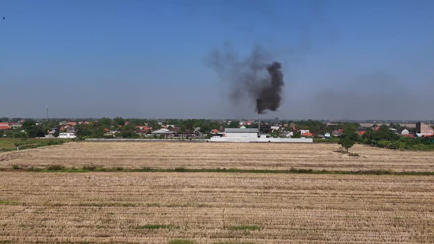 Factories that produce smoke will produce pollutants such as nitrogen oxides, sulfur dioxide and hydrocarbons.  Factory smoke is one of the main causes of air pollution | Shutterstock HD Video #1112124139