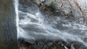 Sturtevant Falls in San Gabriel Mountains - Los Angeles National Forest, waterfall on Santa Anita Creek, near Altadena and Pasadena in Southern California. Time lapse, seamless loop, vertical video