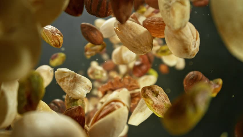 Super Slow Motion of Flying Nuts Mix in Rotating Movement. Filmed on High Speed Cinema Camera , 1000fps.