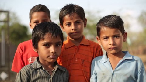 ANDHRA PRADESH, INDIA - CIRCA MAY 2013 - Village children in India smile and pose, close up