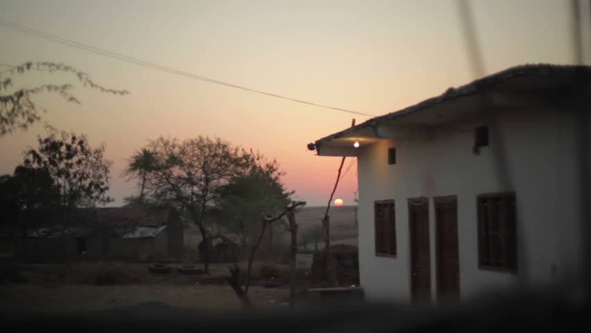 Sunset in an Indian village, long shot, shallow DOF