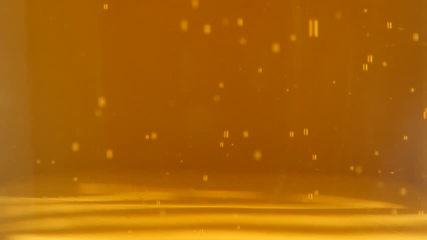 View on  golden beer in the glass spreading bubbles 4K 2160p 30fps UltraHD footage - Light beer foam in bubbles slow spreading in glass 4K 3840X2160 UHD video Royalty-Free Stock Footage #11126126