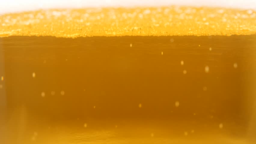 Light golden beer in the glass spreading bubbles 4K 2160p 30fps UltraHD footage - Beer foam in bubbles slow spreading in glass 4K 3840X2160 UHD video Royalty-Free Stock Footage #11126129