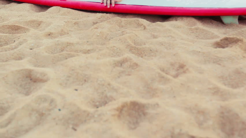 Summer Fun Beach Lifestyle. Beautiful Attractive Young Women Lying on the Beach with Surfboard.