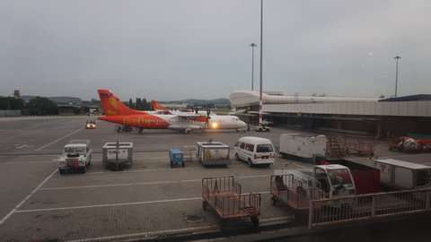 SUBANG SKYWAY AIRPORT -AUGUST 9:Timelapse Firefly Airlines planes prepare for passengers to board, as ground crew prepares the plane for the flight on August 9,2015 in Subang Airport,Subang,Malaysia.