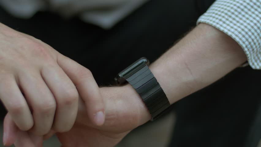 Man interacting with smart watch close up