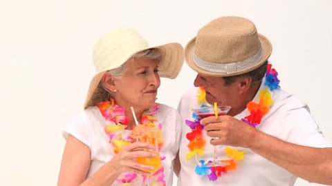 Couple enjoying their cocktails isolated on a white background