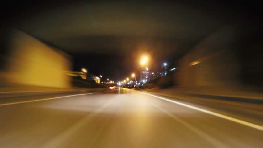 Time-lapse POV shot of a car driving through the city at night. Camera mounted on car hood facing forward. | Shutterstock HD Video #11155223