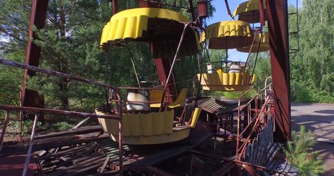 Aerial drone footage. A Ferris wheel in Pripyat, near Chernobyl.The giant Ferris wheel was never loaded. The park was only opened for one day, and almost immediately abandoned. 4K.