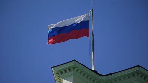 MOSCOW, RUSSIA – JUNE 07, 2015 : Russian flag on the roof of the building