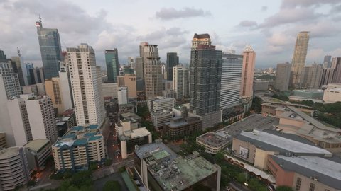 Manila, Philippines - Aug 8, 2015: Metro Manila Day to Night timelapse. Elevated, night view of Makati, one of the most developed business district of Metro Manila.