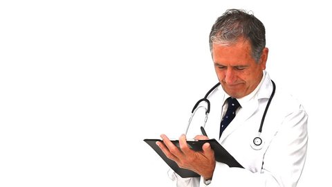 Mature doctor taking notes against a white background, Healthcare workers in the Coronavirus Covid19 pandemic