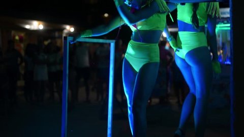 ZHELEZNY PORT, UKRAINE - AUGUST 05, 2015: Girls ass naked go-go dancers PJ in a public place on the night street