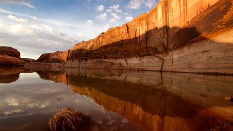 Sunrise time lapse on Lake Powell as the sun lights up the cliffs with reflect in the water. This is a transition shot.