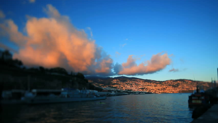 Two kayaks at evening harbor with sunset 
